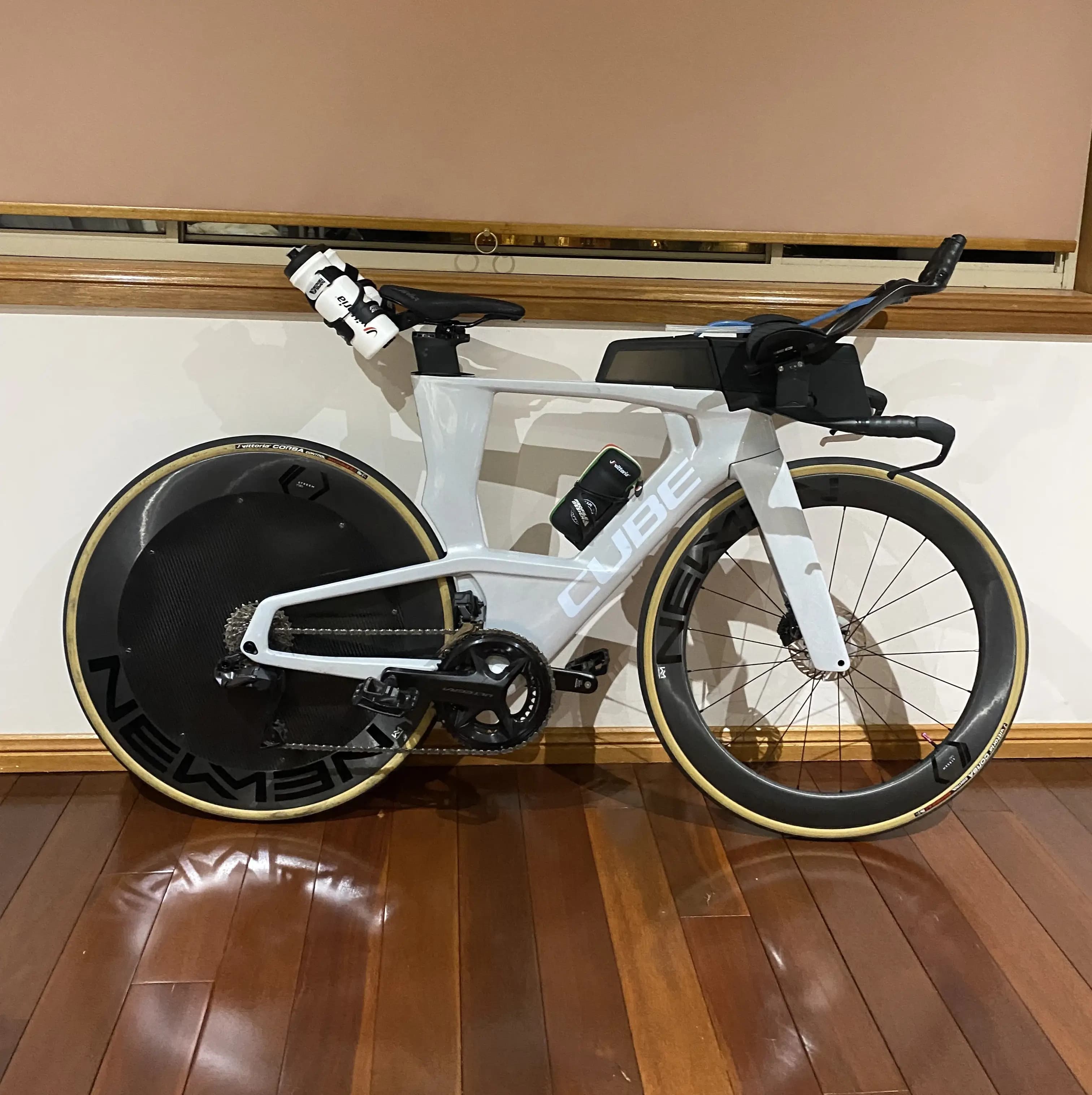 Streamline carbon wheel cover installed on rear wheel for triathlon or TT bike.