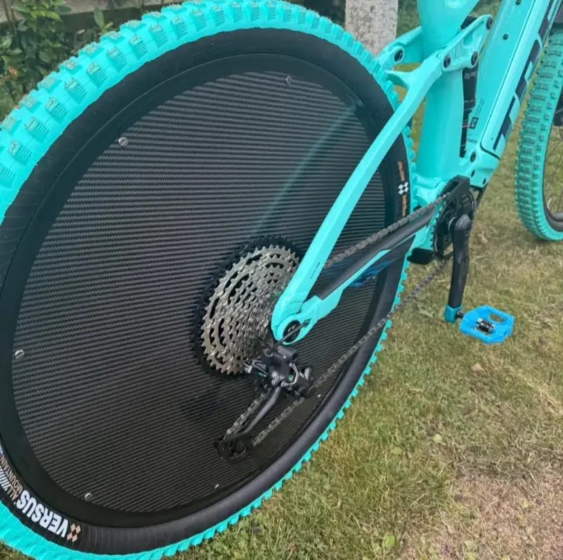 Aero cycling wheel cover fitted to rear disc brake wheel — front view.